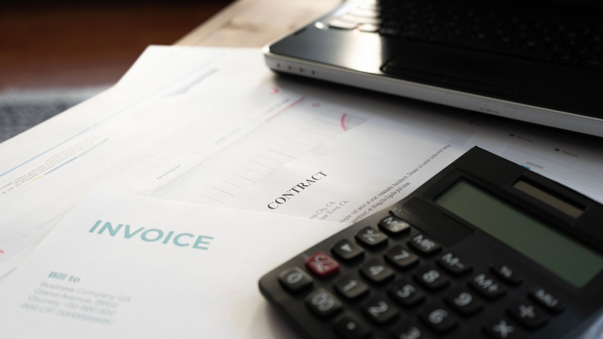 Close-up of contract paper and invoices